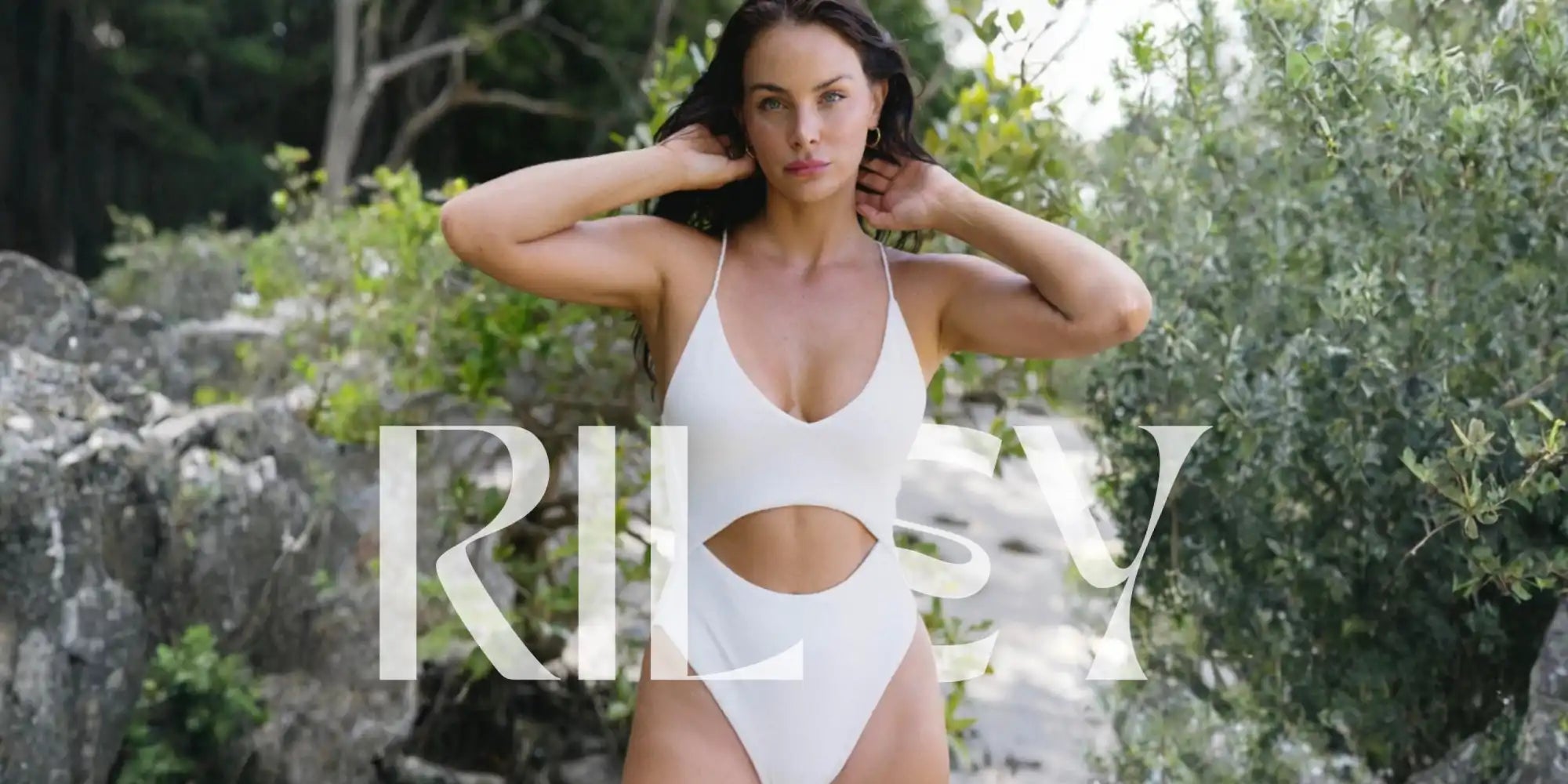 White one-piece swimsuit with a midriff cutout.